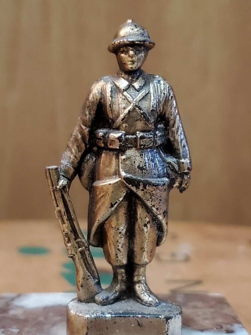 World War I French "Poilu" soldier figurine mounted on a marble